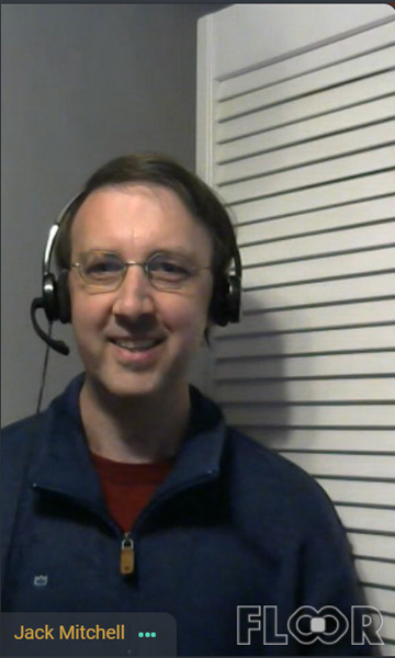 Picture of Jack Mitchell wearing headphones and smiling.